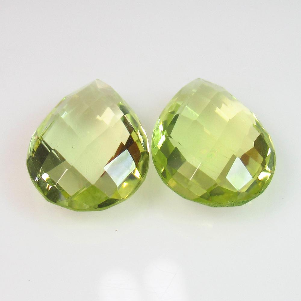 9.09 Ctw Natural Lemon Quartz Pear Checkerboard Cut: No Reserve! Title: 9.09 Ctw Natural Lemon Quartz Pear Checkerboard Cut Pair Stone Clarity: VVS Gemstones: Lemon Quartz Carat Weights: 9.09 Size/Dimensions: 14.10 x 10.20 x 5.80 mm / 2 PC's Additional 