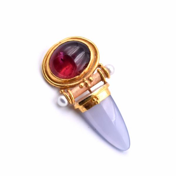 18k Yellow Gold Tourmaline and Chalcedony Pin: Designer: custom design Material: 18k yellow gold Gemstones: Tourmaline and Chalcedony Dimensions: pin measures 38.90mm in height and 20.20mm in width Weight: 8.90 grams ... Reserve: $1,245.00 Shippin