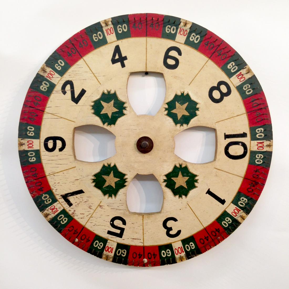 C1900 Carnival Gamewheel In Great Paint: Title: C1900 Carnival Gamewheel In Great Paint Dimension: 23 1/2" diameter. 3/4" thick. Provenance:All original. Nice surface. Shipping: Domestic: Flat-rate of $65.00 to anywhere within the contiguous