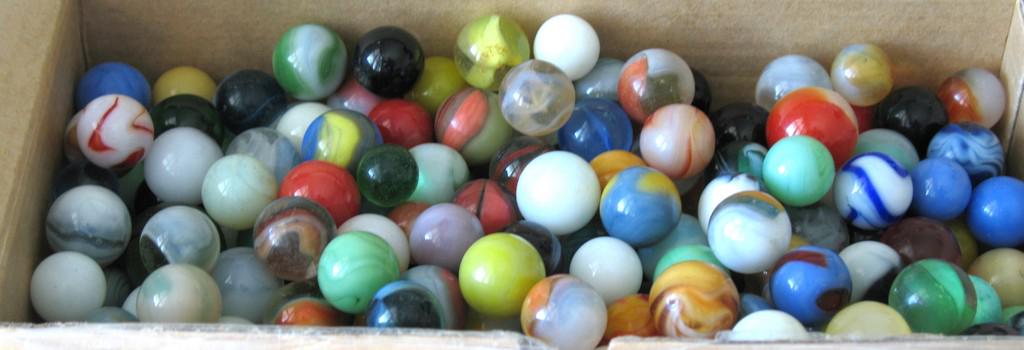 Collection of glass marbles.: Title: Collection Of Glass Marbles Date/Period: 1950's and earlier Dimension: marble size Provenance:Nice collection of over 250 vintage glass marbles. Shipping: Domestic: Flat-rate of $30.00 to anywh