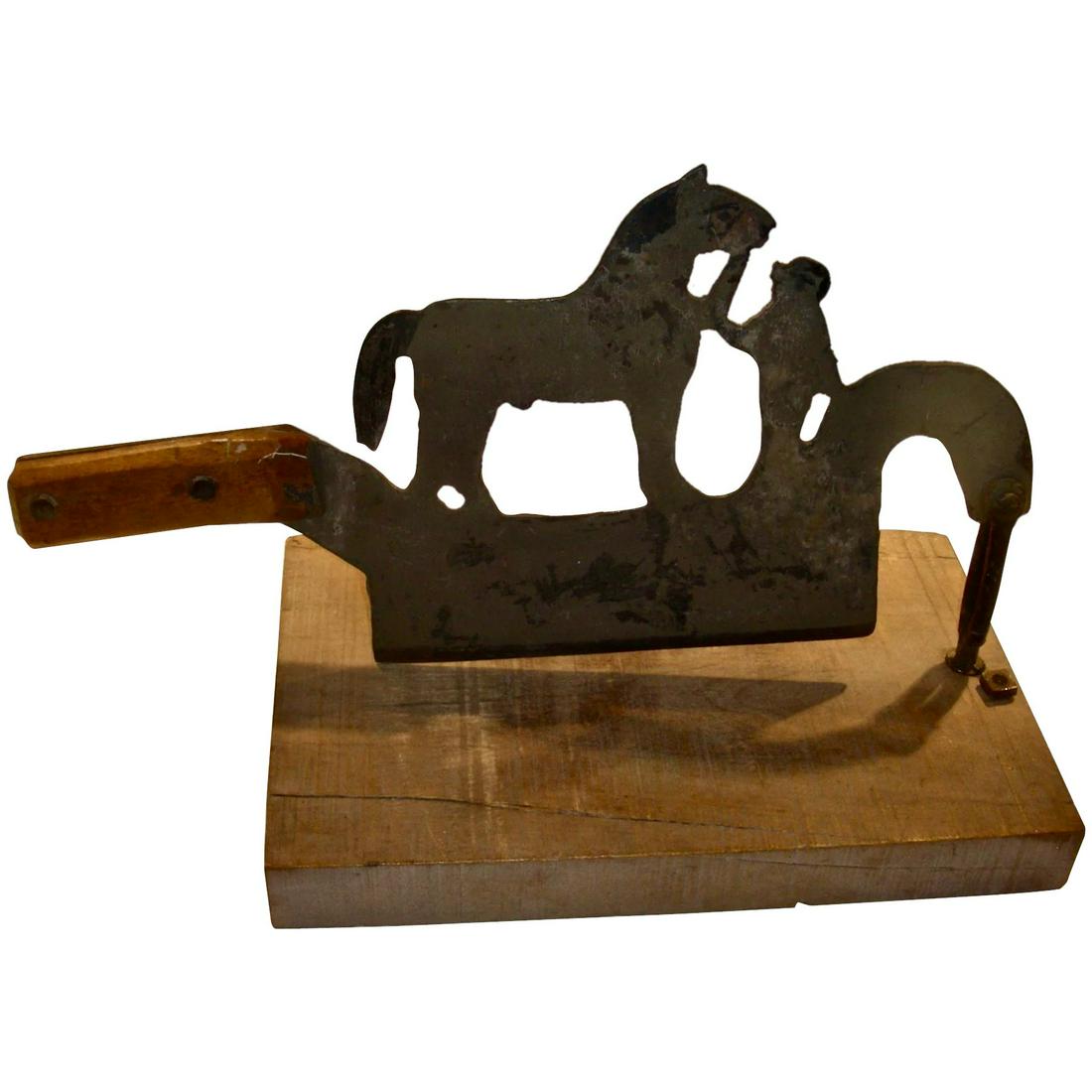 Unusual Horse & Groom Tobacco or Herb Chopper: A most unusual iron tobacco or herb chopper showing a horse and groom. Dating to the late 19th/early 20th centuries, the chopper has a wooden handle and can be mounted on a wood block (that will come