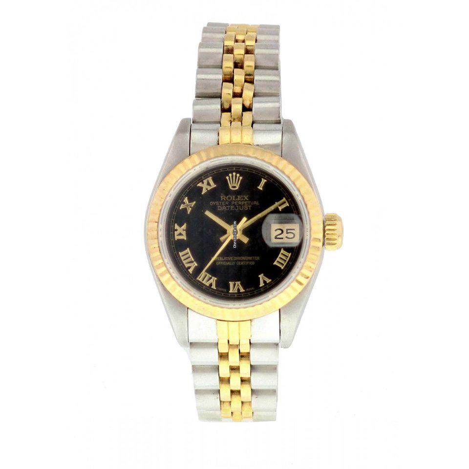 Rolex Datejust 69173 Pyramid Dial Watch: Details Rolex Oyster Perpetual Datejust Ladies Watch. 26 mm stainless steel case. 18k yellow gold fluted bezel. Black pyramid dial with yellow gold hands and Roman numeral hour markers. 18k yellow gol