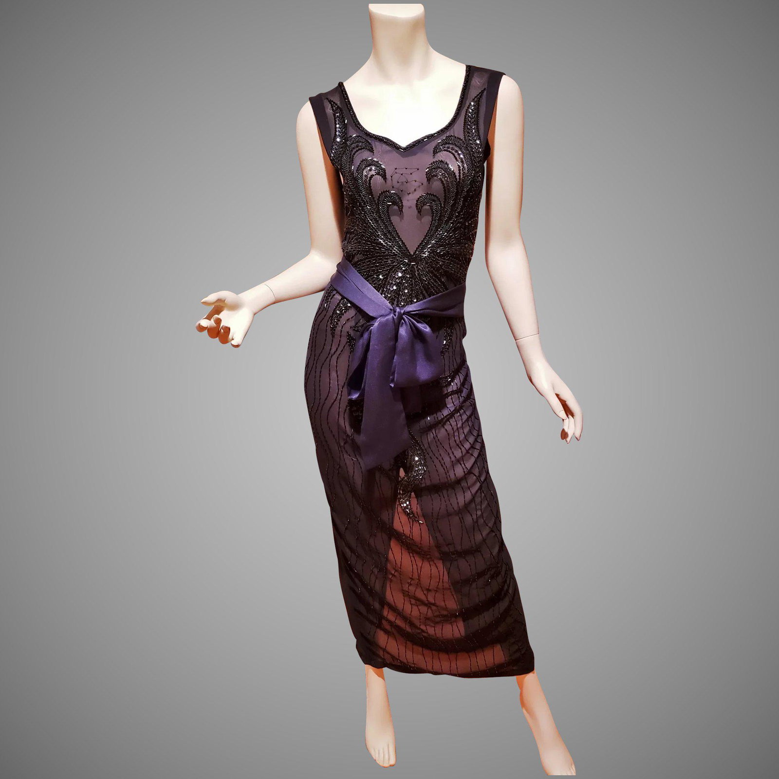 Layering Onyx beaded dress w/Sash belt: A work of Art. Hand beaded in an amazing leaf design on voile with black onyx beads. The sash belt is a soft Satin of silk blend. In very good vintage condition and a beauty Size-12 Vintage or /M Bust