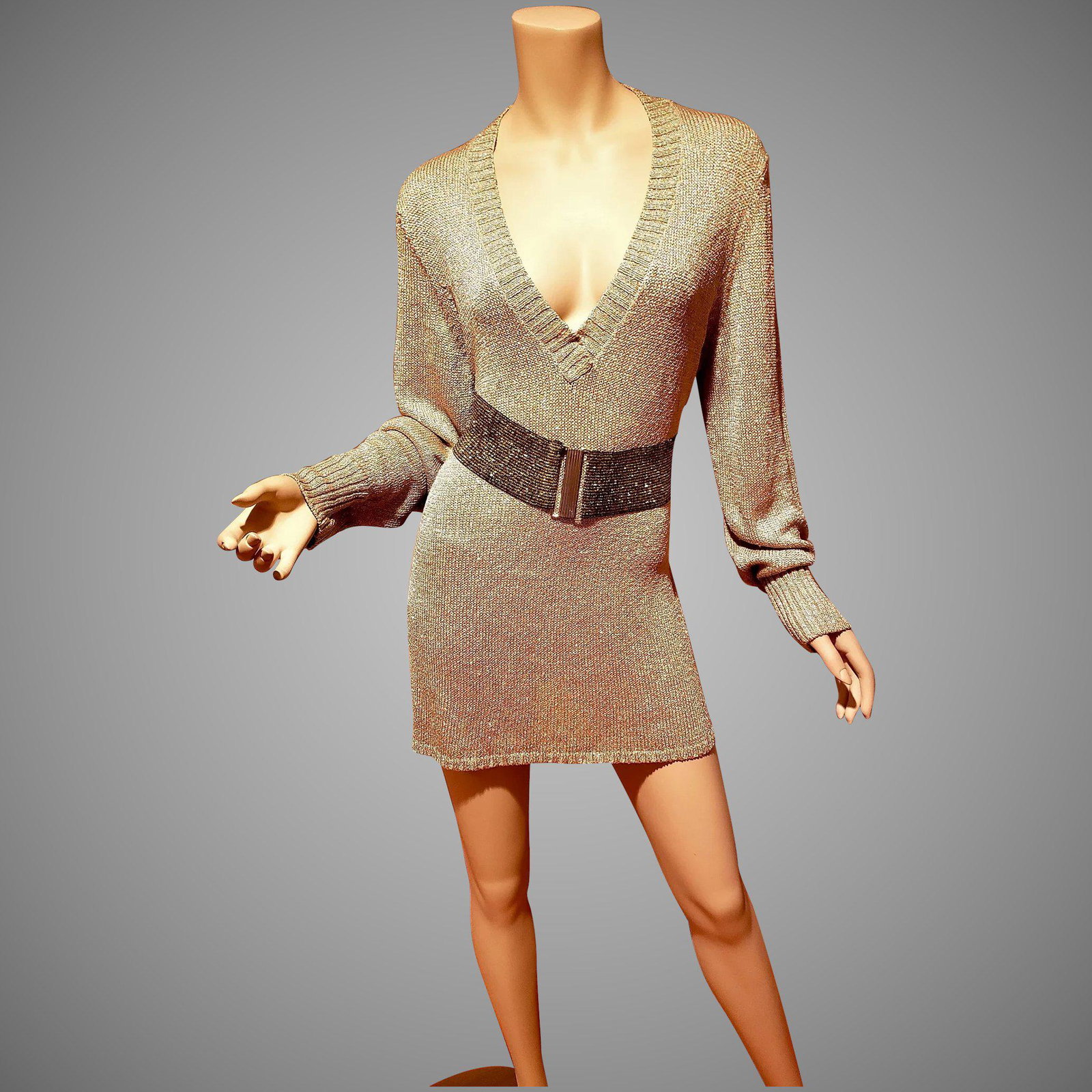 Vtg Lurex V neck knit sweater dress or tunic: Classic beauty Lurex Gold sweater mini dress/or Tunic , plunge V. In very good vintage condition. I am showing it here with a Vintage gold elastic belt, Which is NOT INCLUDED A size Large Please note 