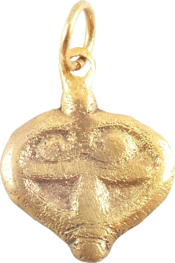 GOOD VIKING HEART PENDANT 9th-10th CENTURY AD: 3/4” height, of elegant form. Broad heart with raised edge, transverse median over a vertical with double scrolls above. Stippled ground with the relief surfaces quite smooth. For Vikings, the heart