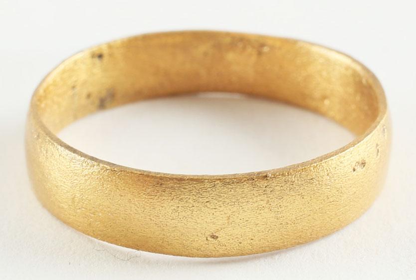 FINE VIKING WOMAN’S WEDDING RING, 9TH-10TH CENTURY AD.: Gilt bronze, size 7 3/4 Broad band, 4.4 mm, with rounded face. Professionally refurbished with the 24 karat gold surface restored. Vikings exchanged rings on the pommel of the groom’s sword. Gift bo