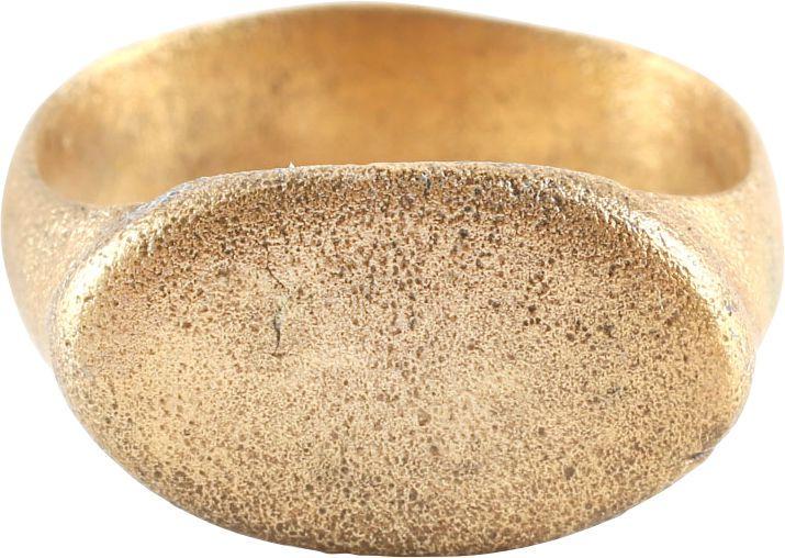 VIKING WARRIOR’S RING, 9th-10th CENTURY AD, SIZE 8 1/2: Size 8 1/2 with broad oval face raised from the shoulders. Broad rounded band flaring to the shoulders. Surface textured from. Professionally refurbished with the gold overlay restored. Gift boxed wit
