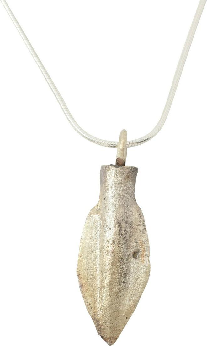 FINE GREEK SOCKETED ARROWHEAD 690-250 B.C.: Bronze, 1 1/8” length plus the loop. Bilobate form with conical socket extending to the point and especially broad, double veins. Professionally refurbished with a silver overlay and mounted on a mo