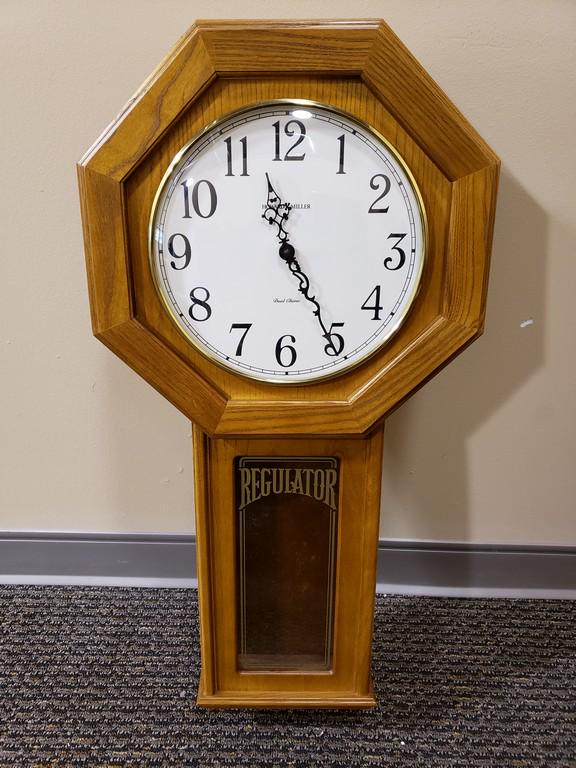 Howard Miller Ansley Wall Clock Model: Title: Howard Miller Ansley Wall Clock Model Maker: Howard Miller Company Origin: USA Medium: Traditional Size:31" H x 15" W x 3.75" D Description:The Ansley Wall Clock by Howard Miller is finished in