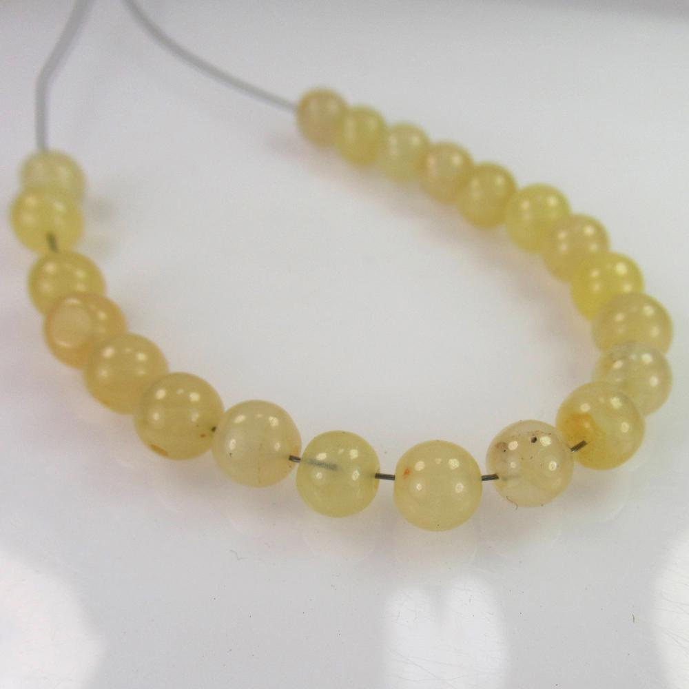 17.66 Ct Genuine 21 Drilled Moonstone Ball Beads: No Reserve! Title: 17.66 Ct Genuine 21 Drilled Moonstone Ball Beads Stone Clarity: Semi-TransparentLoose Gemstone: Natural Moonstone Beads Carat Weights: 17.66 Size/Dimensions: 4.90 - 5.00 mm / 21 PC'