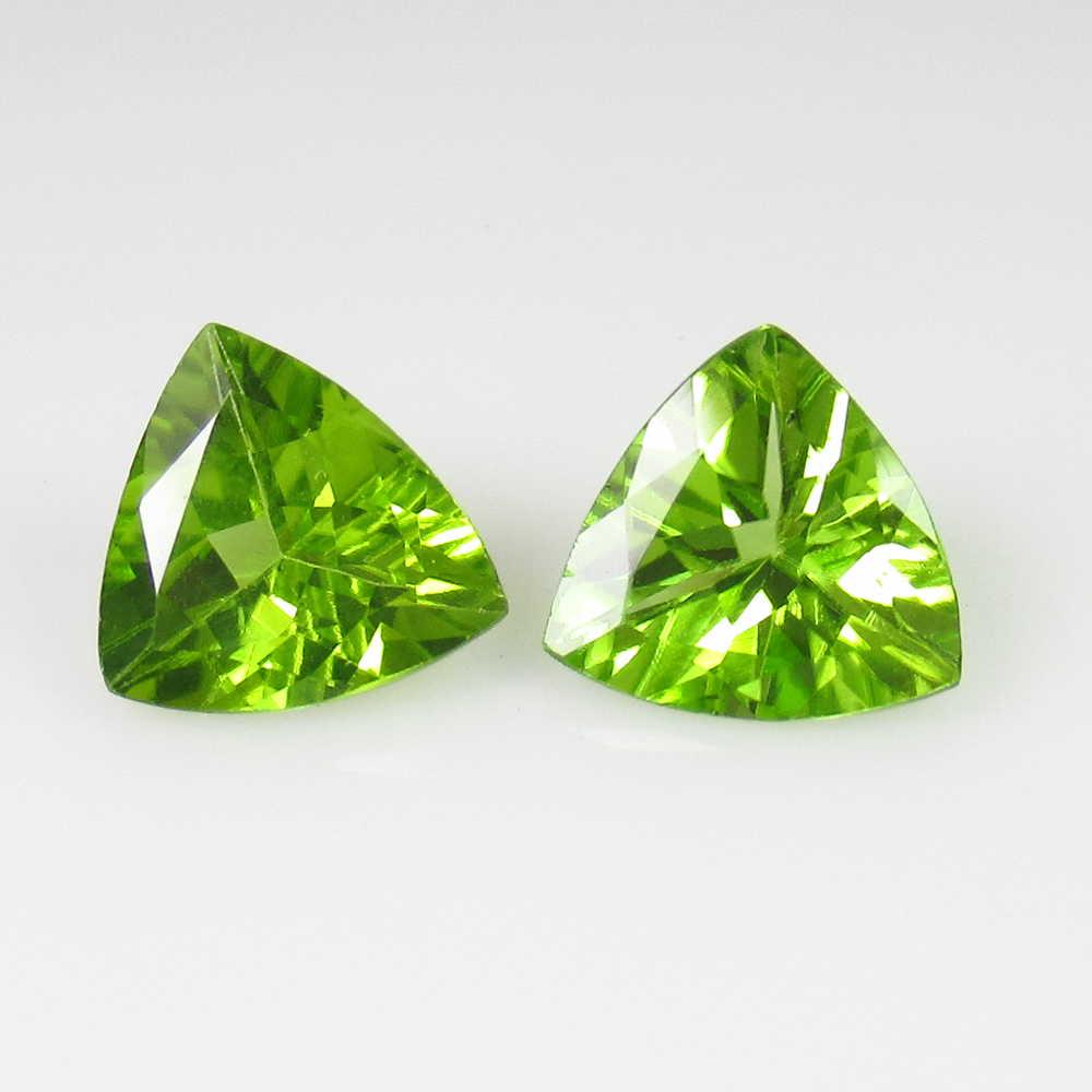 2.18 Ct Genuine Pakistan Peridot Trillion Pair: No Reserve! Title: 2.18 Ct Genuine Pakistan Peridot Trillion Pair Stone Clarity: VVS Gemstone: Natural Peridot Carat Weights: 2.18 Size/Dimensions: 7.10 x 7.00 x 4.00 mm / 2 PC's Top Class Full Luster