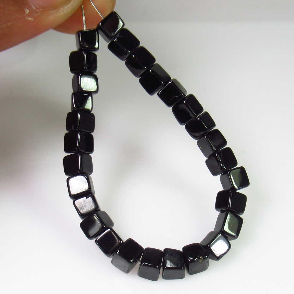 22.86 Ct Genuine 28 Drilled Black Spinel Square Beads: No Reserve! Title: 22.86 Ct Genuine 28 Drilled Black Spinel Square Beads Stone Clarity: Opaque Gemstone: Natural Black Spinel Beads Carat Weights: 22.86 Size/Dimensions: 3.90 - 4.20 mm / 28 PC's Drill