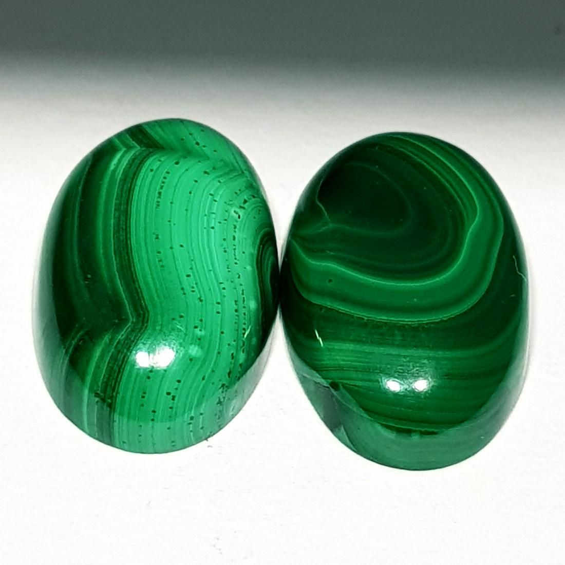 22.60 ct Pair of Natural Malachite: No Reserve! Title: 22.60 ct Pair of Natural Malachite Color/Clarity: Opaque Gemstones: Loosegemstone Carat Weights: $23 Size/Dimensions: 18.10 x 11.10 x 4.60/17.40 x 11.30 x 5.30 Additional Informatio