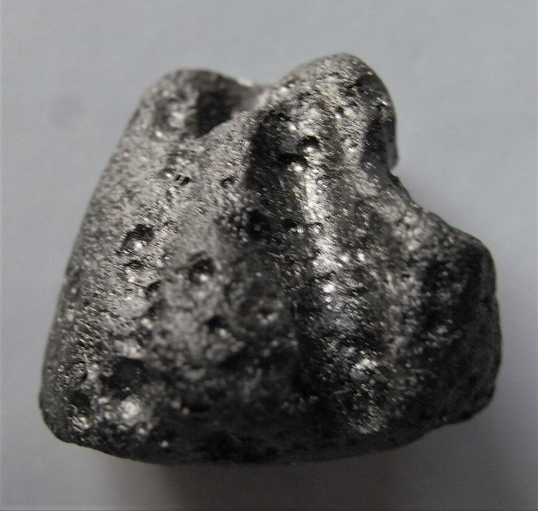 PHILIPPINITE TEKTITE - FROM METEORITE IMPACT: Title: PHILIPPINITE TEKTITE - FROM METEORITE IMPACT Origin: Paracale, Camarines Norte, Luzon, Philippines Size: 2x1.5x1.5 cm / 5 gram Description: small sculptural philippinite / rizalite tektite with