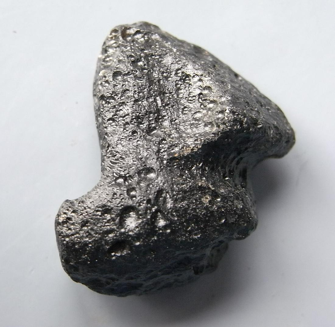 PHILIPPINITE TEKTITE - FROM METEORITE IMPACT: Title: PHILIPPINITE TEKTITE - FROM METEORITE IMPACT Origin: Paracale, Camarines Norte, Luzon, Philippines Size: 2.5x2x1 cm / 7 gram Description: fairly thick, sculptured philippinite / rizalite tektit