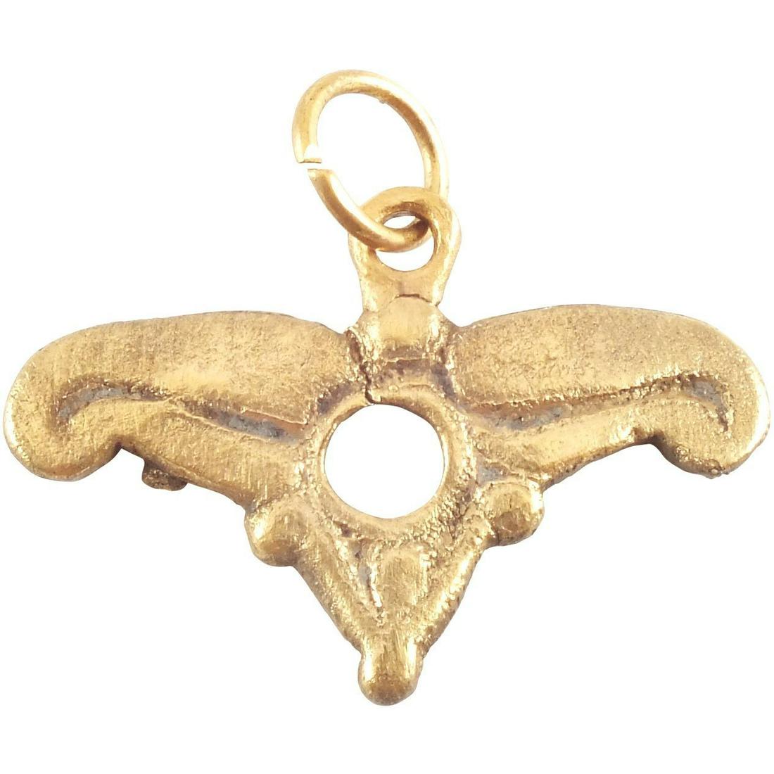MEDIEVAL PENDANT C.1400: French or Flemish. 7/8” wide. Rounded triangle comprised of a triple fleur, pierced in the center. Professionally refurbished with the gold overlay restored for contemporary wear. Gift boxed with ce