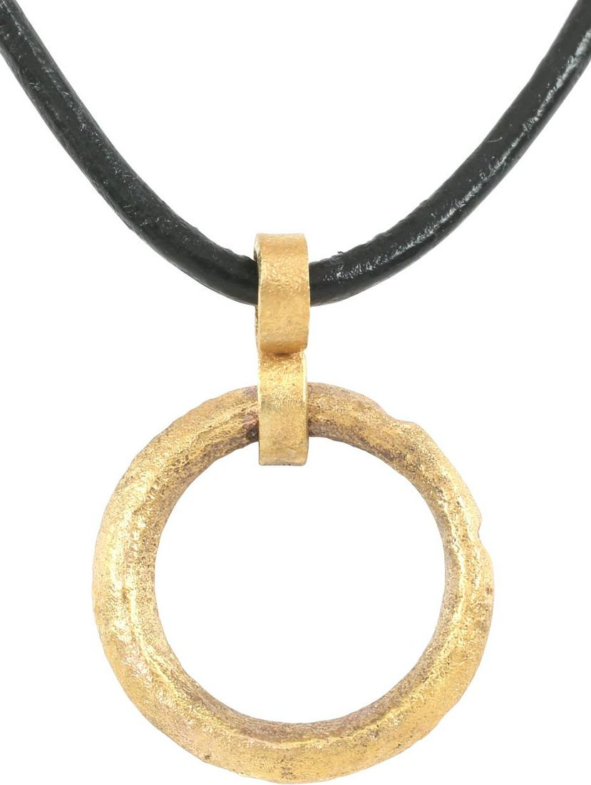 VIKING PROTECTIVE BROOCH PENDANT 10th CENTURY: Circular bronze, 3/4” diameter with both faces rounded and the inner and outer edges ridged. The surface with light texture from burial. Professionally conserved and the gold surface restored. On a 