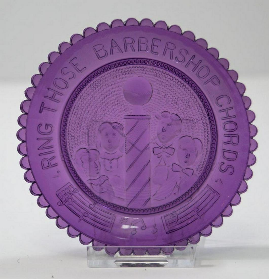 Barbershop Chords QuartetPairpoint Cup Plate: Title: Barbershop Chords QuartetPairpoint Cup Plate Dimension: App. 3 ½” diameter Provenance:A Pairpoint Cup Plate, produced in 1979, Barbershop Chords design, Amethyst color with 25 scallop dot ri