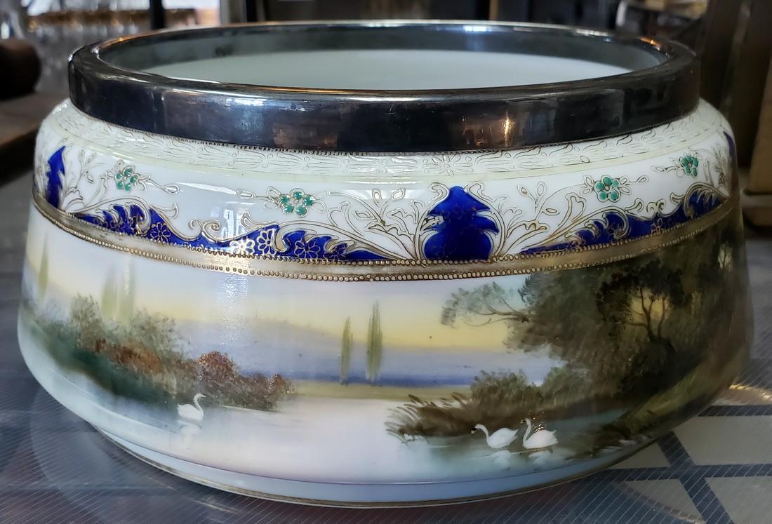 Circa 1920 Japanese Noritake Porcelain Planter with: Title: Circa 1920 Japanese Noritake Porcelain Planter with English Purcell Bros. Silver Plated Rim Date/Period: Circa 1920 Materials: Porcelain, metal Dimensions: 3 3/4" tall, 8 5/8" in diameter at it