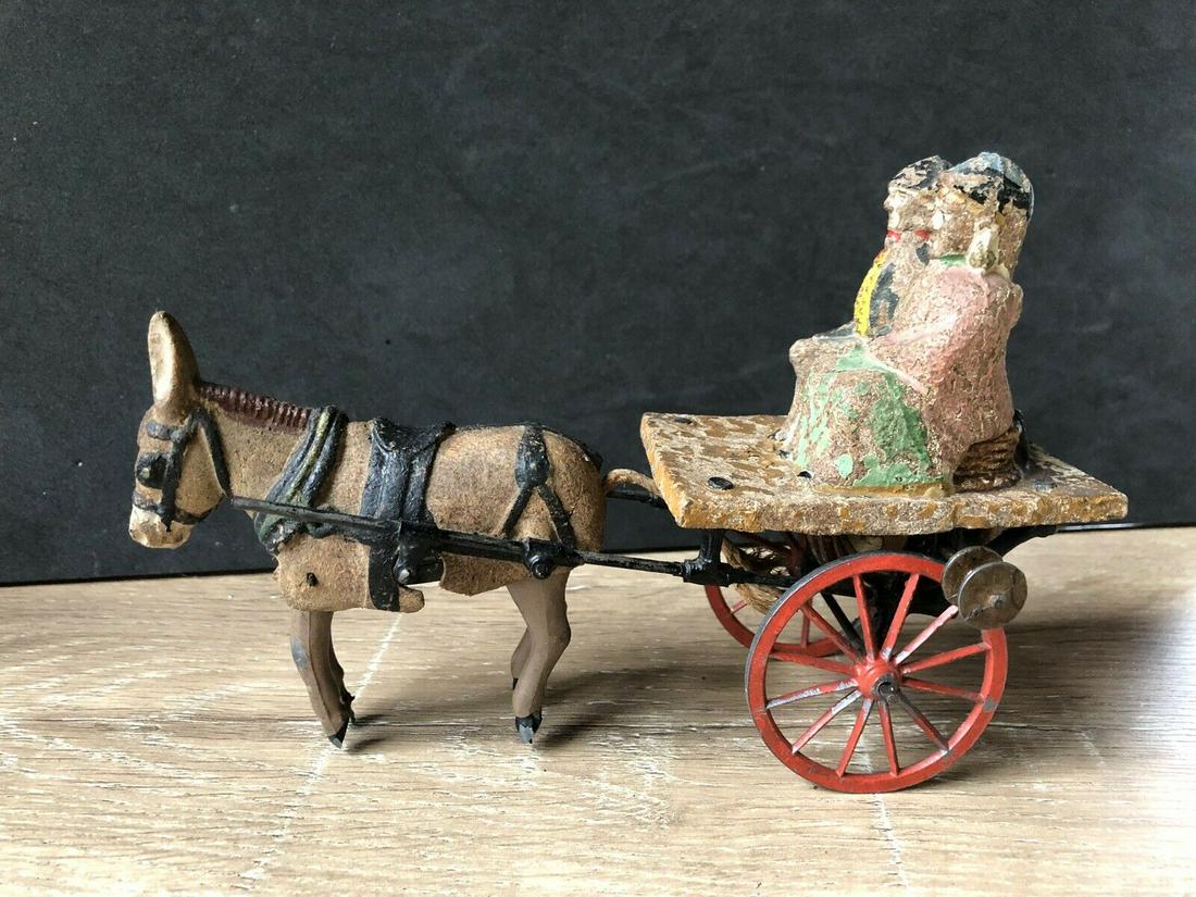 Britains: Extremely Rare Mechanical Galloping Donkey: Title: Britains: Extremely Rare Mechanical Galloping Donkey Cart. Circa 1883 Description: Generally good condition with some paint loss to the riders. Unboxed and extremely rare. One of the earliest e