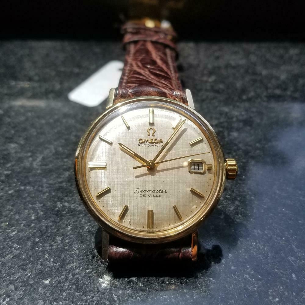 OMEGA Men's 14k Gold Seamaster DeVille cal.563: Luxurious vintage classic, men's 14k solid gold Omega Seamaster DeVille automatic, c.1967. Verified authentic by a master watchmaker. Gorgeous Omega tapestry dial, applied gold baton hour markers, gol