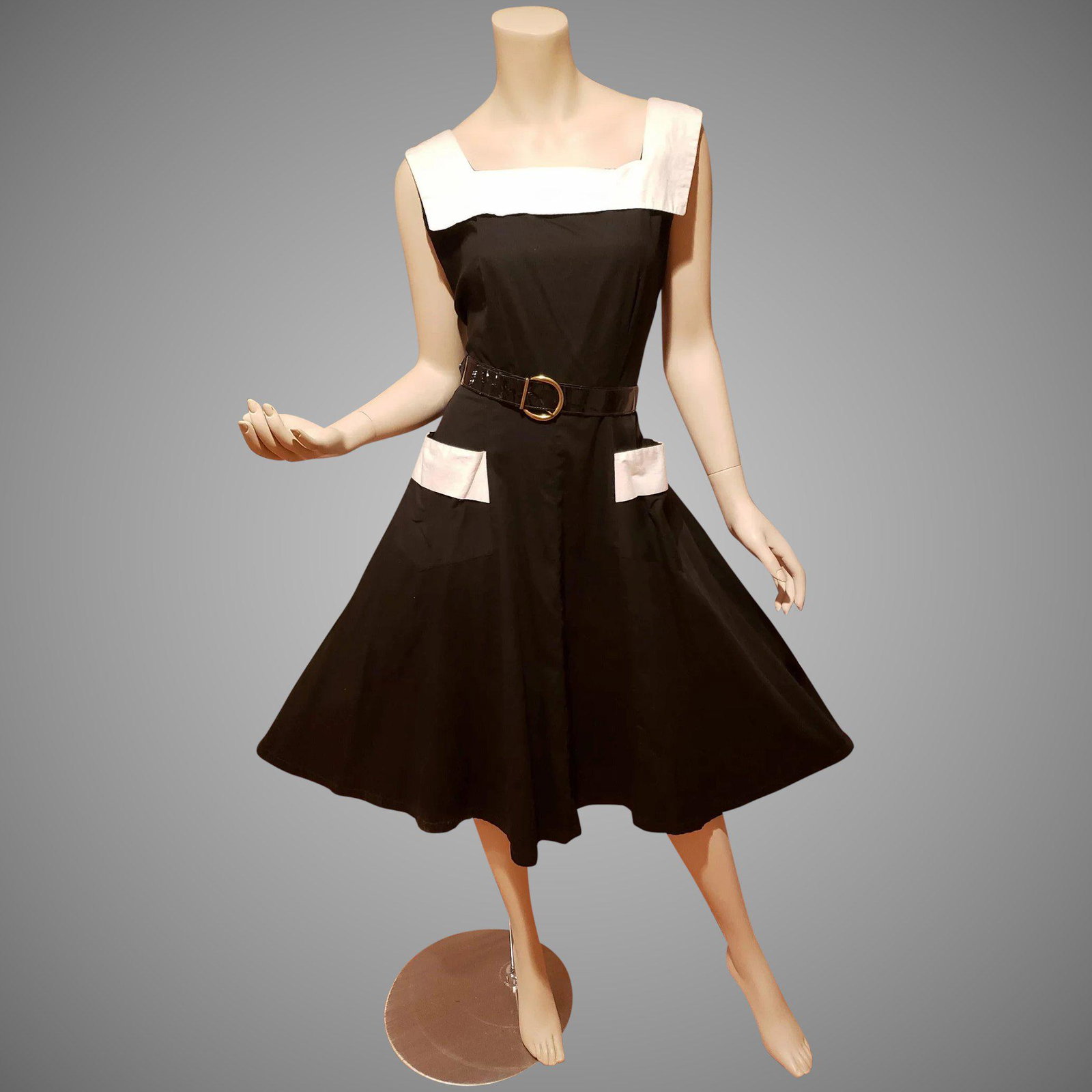 Full Circle 1950's Black/White Cotton dress open: Circa 1950's Jean Robert full circle dress with open white trim Pockets and square neckline. Side metal zipper and Lacquered buckle belt. In very good vintage condition and a beauty Bust-36" Waist-29"