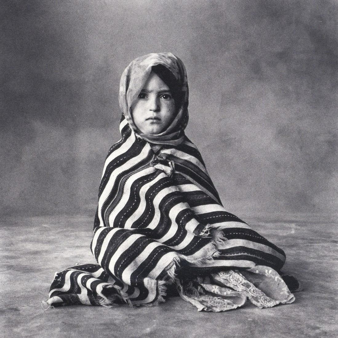IRVING PENN - Child of Imilchil, New Guinea: Artist: IRVING PENN Print Title: Child of Imilchil, New Guinea Medium: Photoengraving Printed 1970’s in the US Image size (inches) approx. 4 x 4” Irving Penn was an American photographer known for