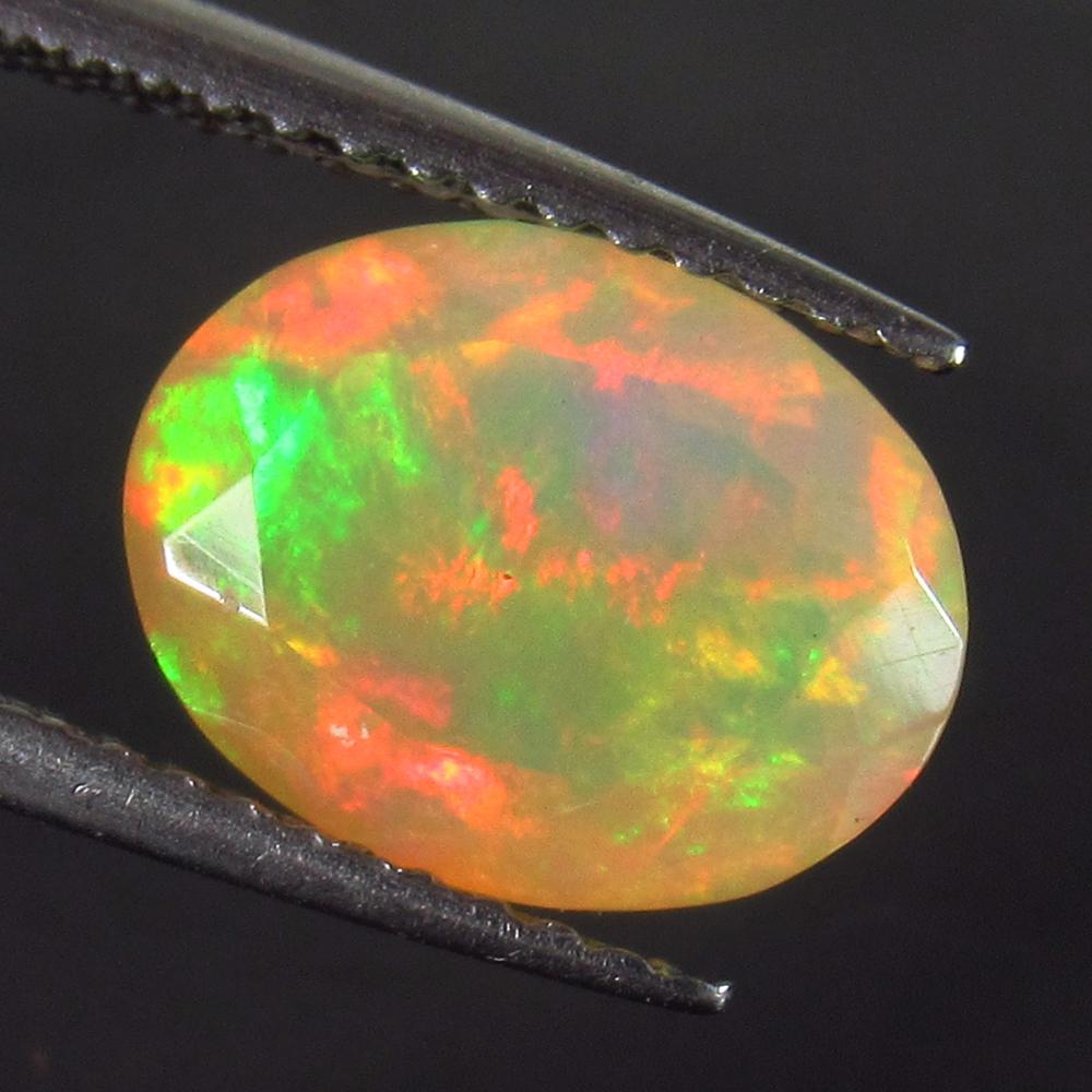 1.65 Ct Genuine Multi-Color Fire Faceted Opal Oval Cut (1 of 2)
