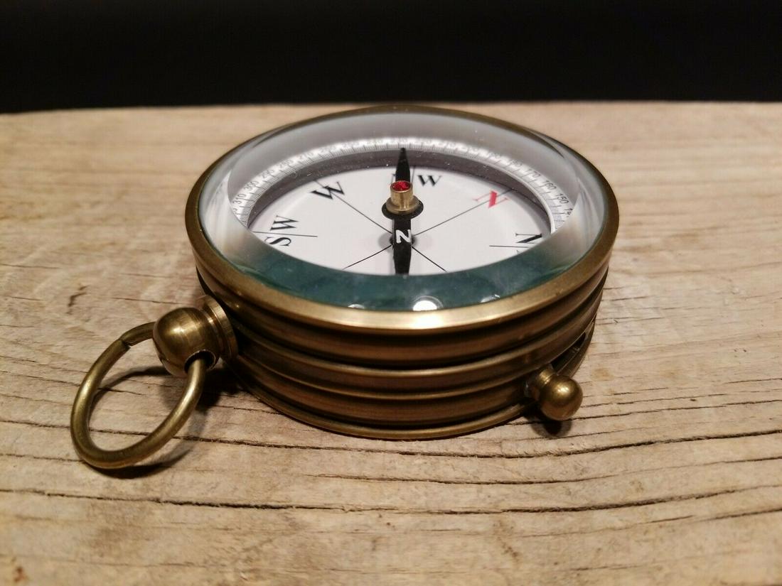 Beveled Glass Navigational Compass: 3" wide x 1" tall Nice reproduction of an antique compass. Great heavy quality piece made to look like an original! Reserve: $27.00 Shipping: Domestic: Flat-rate of $6.00 to anywhere within the contig