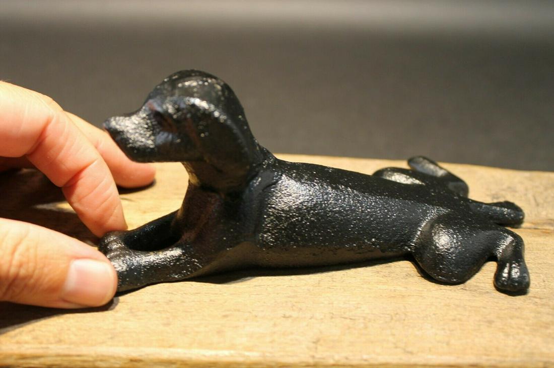 Cast Iron Door Stop Dog Wedge Black: 6 1/4" Long x 3 1/2" Wide Nice Reproduction antique solid cast iron black dog door wedge. This dog is much thicker, and heavier then other similar ones we have seen. Please see the images. Certainly a