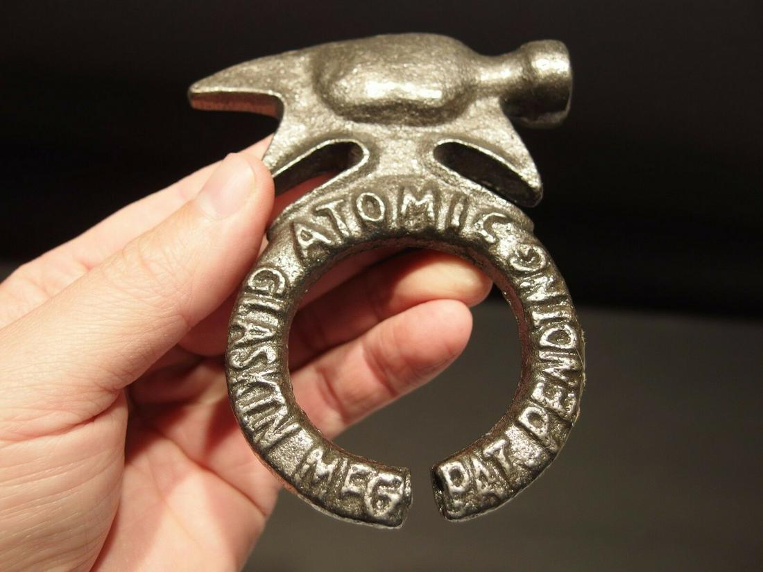 ATOMIC Glaskin Mfg Co Pat Pending Hand Line Rider: 4 1/4" x 3 1/2" Wonderful reproduction cast iron multi tool with a hammer. As you can see it is marked with raised letters "Atomic Glaskin MFG Pat Pending" Wonderful multi use tool for use or display.