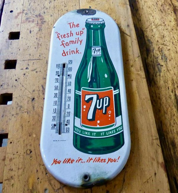 Vintage Metal 7-Up Sign with Thermometer: Title: Vintage Metal 7-Up Sign with Thermometer Maker/Brand: Unknown Origin: USA Date/Period: 1950 Materials: Metal Size: 15HÂ” x 6WÂ” x 0.5DÂ” Petit, wall mounted, single-sided 7-Up sign wit