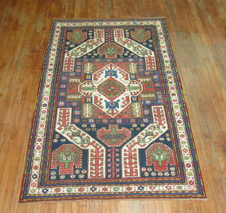Vintage Kazak Rug: Title: Vintage Kazak RugSize: 4' 10" x 7' (147 x 213 cm)Rug Type: KazakSize/Category: Intermediate Reserve: $4,850.00 Shipping:Domestic: Flat-rate of $50.00 to anywhere within the contiguous