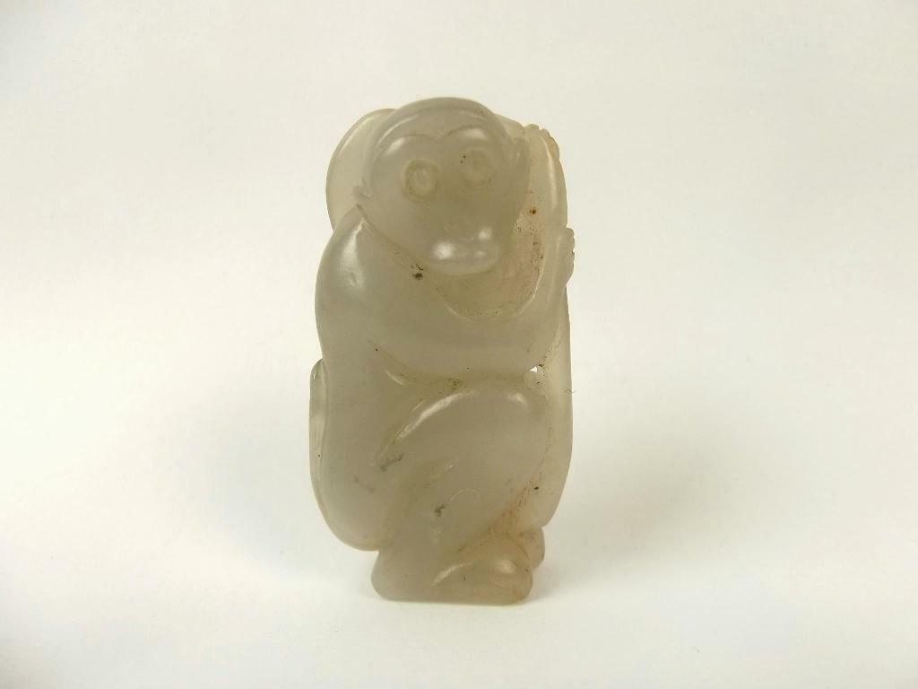 Chinese Ching Dynasty Nephrite Jade Monkey #2: Chinese Ching Dynasty Nephrite Jade Monkey #2 ~ A lovely hand carved jade figure featuring a monkey holding the fungus of luck, dating to the Ching Dynasty era. The nephrite jade is a milky turquoise 