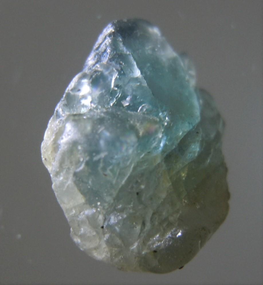 4.25 CT TRANSLUCENT BLUE-GREEN SPINEL: Title: 4.25 CT TRANSLUCENT BLUE-GREEN SPINEL Origin: Mogok Township, Mandalay Region, Myanmar Size: 1.05x0.9x0.55 / 0.85 gram Description: translucent, blue-green spinel with crystalline faces. untrea