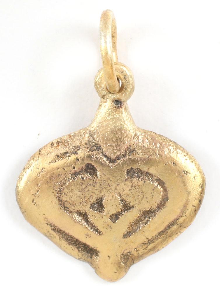VIKING HEART PENDANT 900-1050 AD: Just over ¾” height, made by the open face mold method with a broad border with scrolling terminals and central trefoil motif. Pendular bottom. The foliate trefoil was a very popular motif for Viki