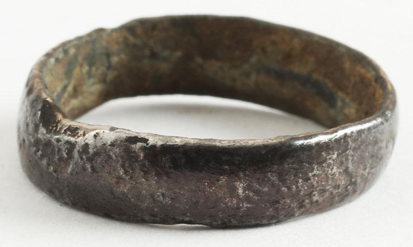 DOUBLY RARE VIKING WEDDING RING SZ 8 ½: No Reserve! Broad band, 5.5 mm. with rounded face. Made of copper. Vikings were master metallurgists and the use of unalloyed copper is specific to Viking culture. Alloying to bronze provides greater 
