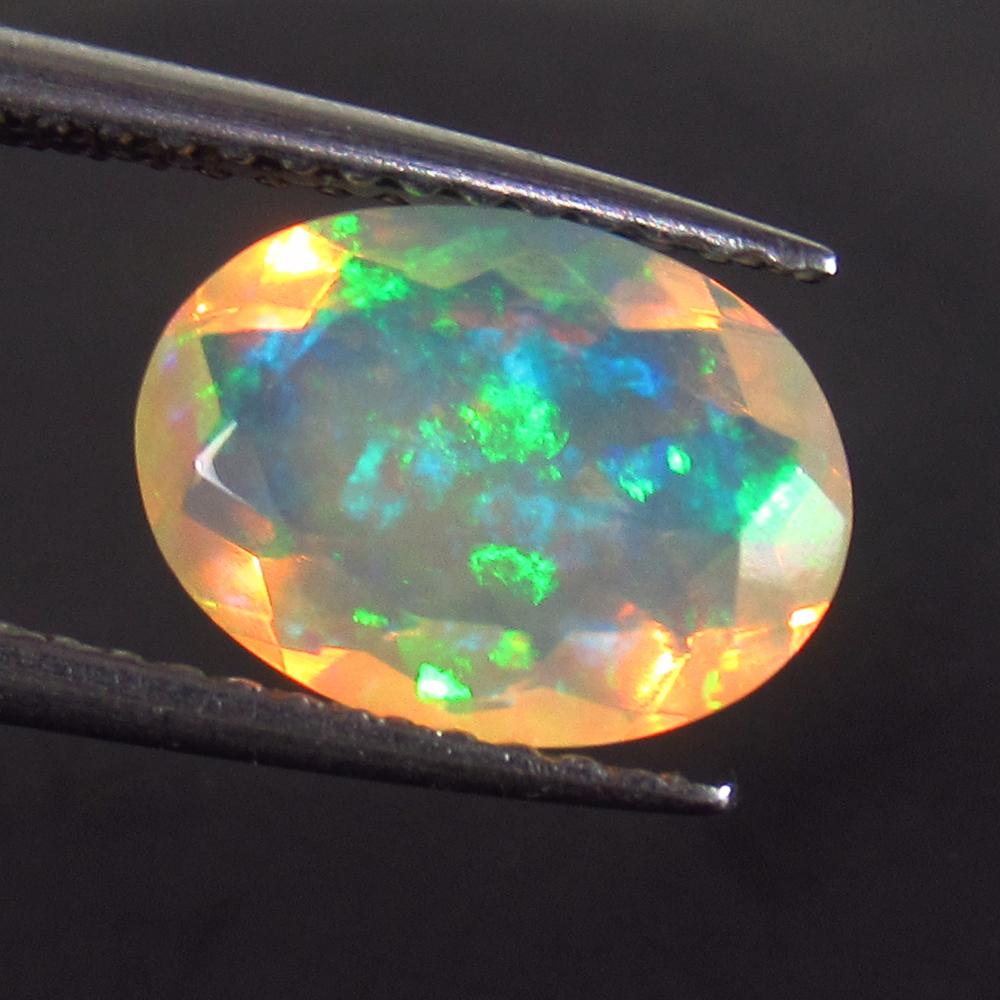 1.49 Ct Genuine Multi-Color Fire Faceted Opal Oval Cut (1 of 2)