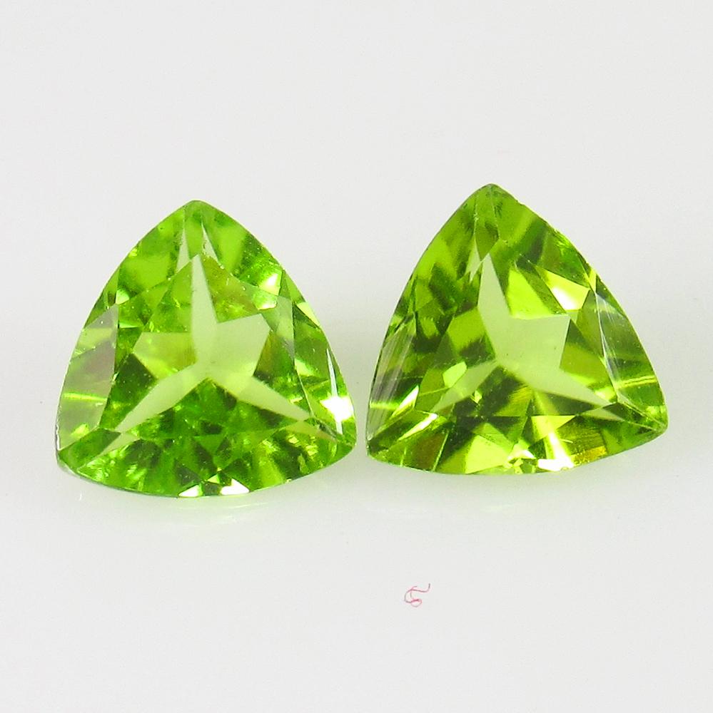 1.92 Ct Genuine Pakistan Peridot Trillion Pair: No Reserve! Title: 1.92 Ct Genuine Pakistan Peridot Trillion Pair Stone Clarity: VVS Gemstones: Natural Peridot Carat Weights: 1.92 Size/Dimensions: 7.20 x 7.20 x 3.50 mm / 2 PC's Additional Informati