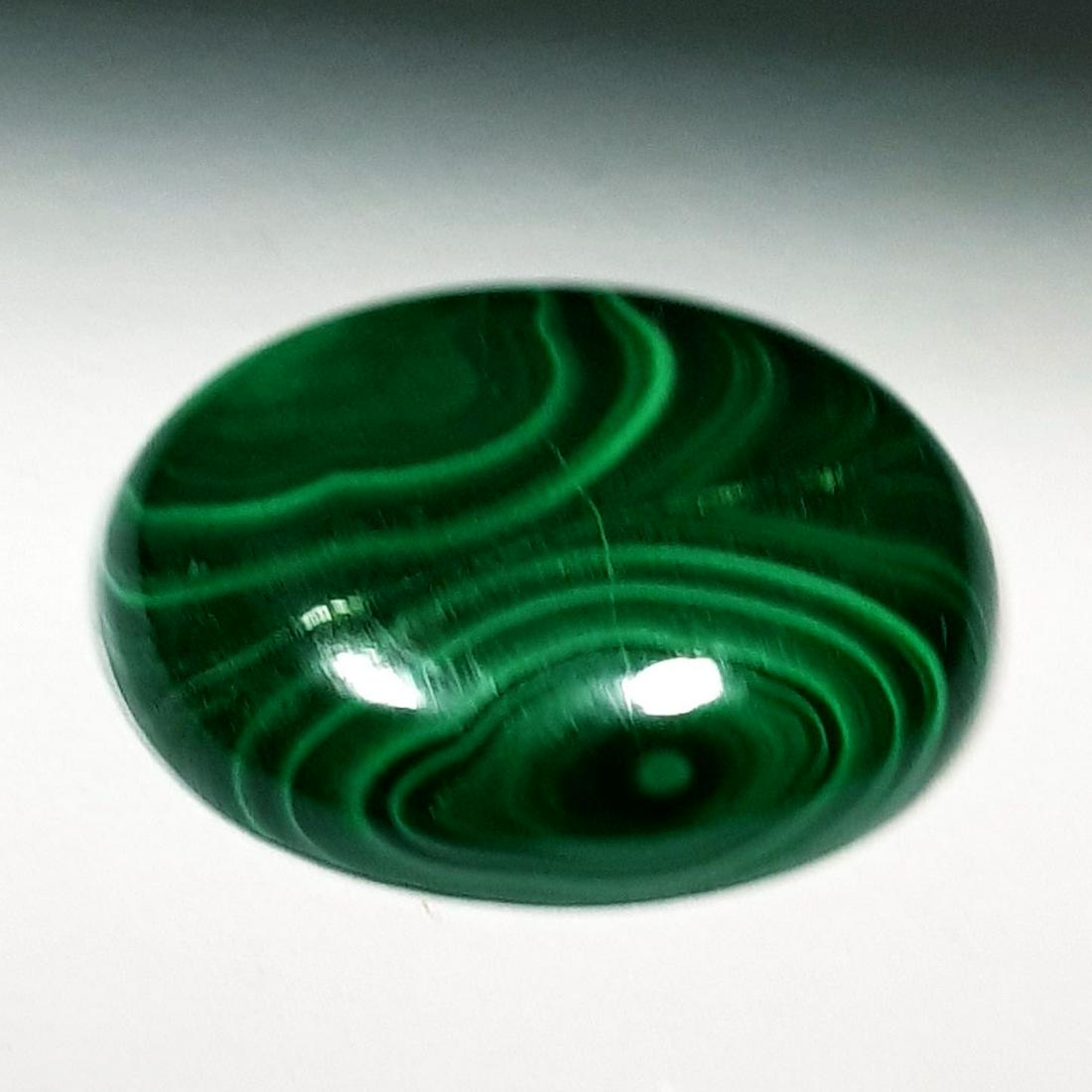 26.95 ct Natural Malachite: No Reserve! Title: 26.95 ct Natural Malachite Color/Clarity: Opaque Gemstones Carat Weights: 26.95 Size/Dimensions: 23.40 x 17.55 x 5.55 Oval - Africa Shipping: Worldwide: Flat-rate of $10.00 to anywh