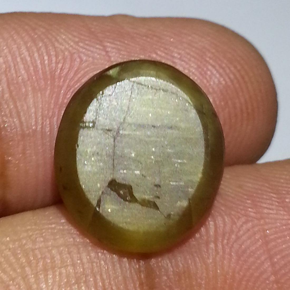 10.15 ct Natural Apatite cat's Eye: No Reserve! Title: 10.15 ct Natural Apatite cat's Eye Color/Clarity: Semi Transparent Loosegemstone Carat Weights: 10.15 Size/Dimensions: 13.80 x 12.40 x 7.00 Oval - Africa Shipping: Worldwide: Flat-r
