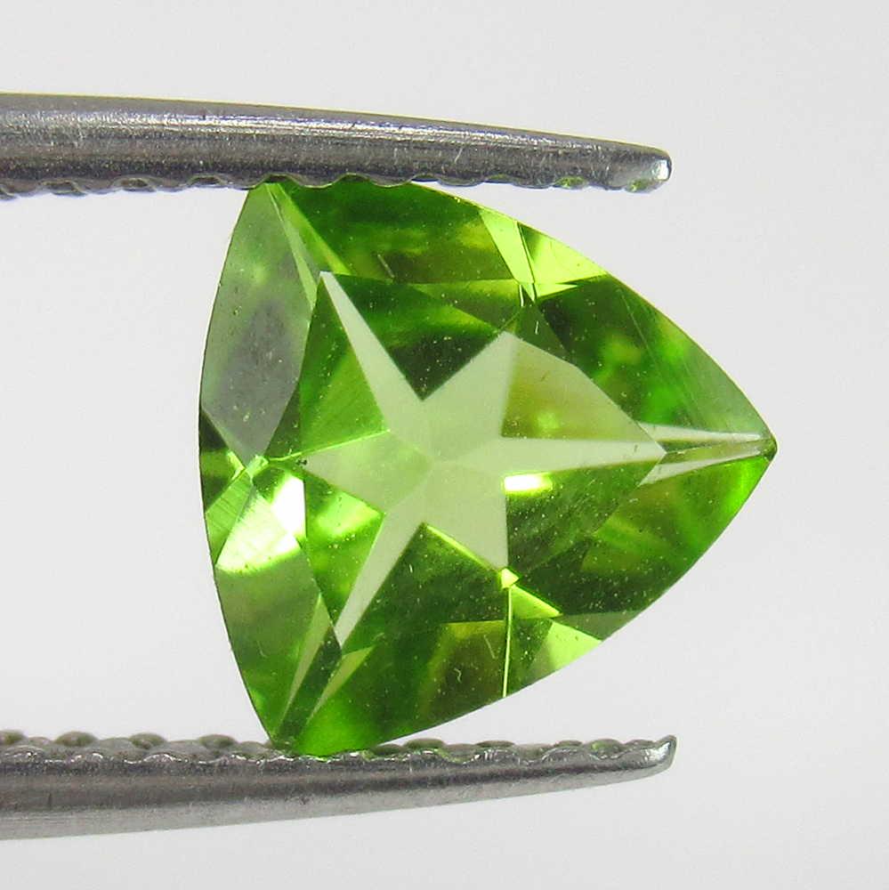 0.91 Ctw Natural Pakistan Peridot Trillion Cut: No Reserve! Title: 0.91 Ctw Natural Pakistan Peridot Trillion Cut Stone Clarity: VVS Gemstones: Peridot Carat Weights: 0.91 Size/Dimensions: 7.10 x 7.20 x 3.40 mm Additional Information: Top Class Lus