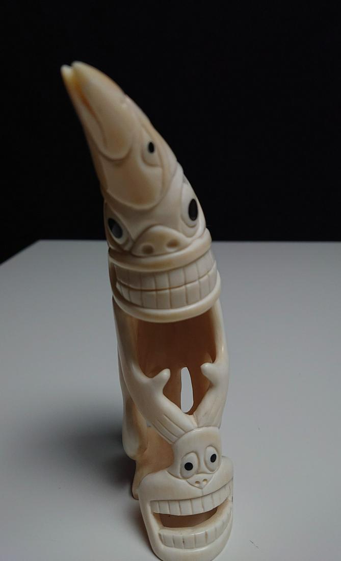 Antique Greenlander INUIT Tupilak - WHALE TOOTH: Title: Antique Greenlander INUIT Tupilak - WHALE TOOTH Date/Period: Early 20th century Origin: Greenland Dimension: 5.2 inches - 115 grams Material: Whale tooth Provenance:Great four-faced Eskimo tupi