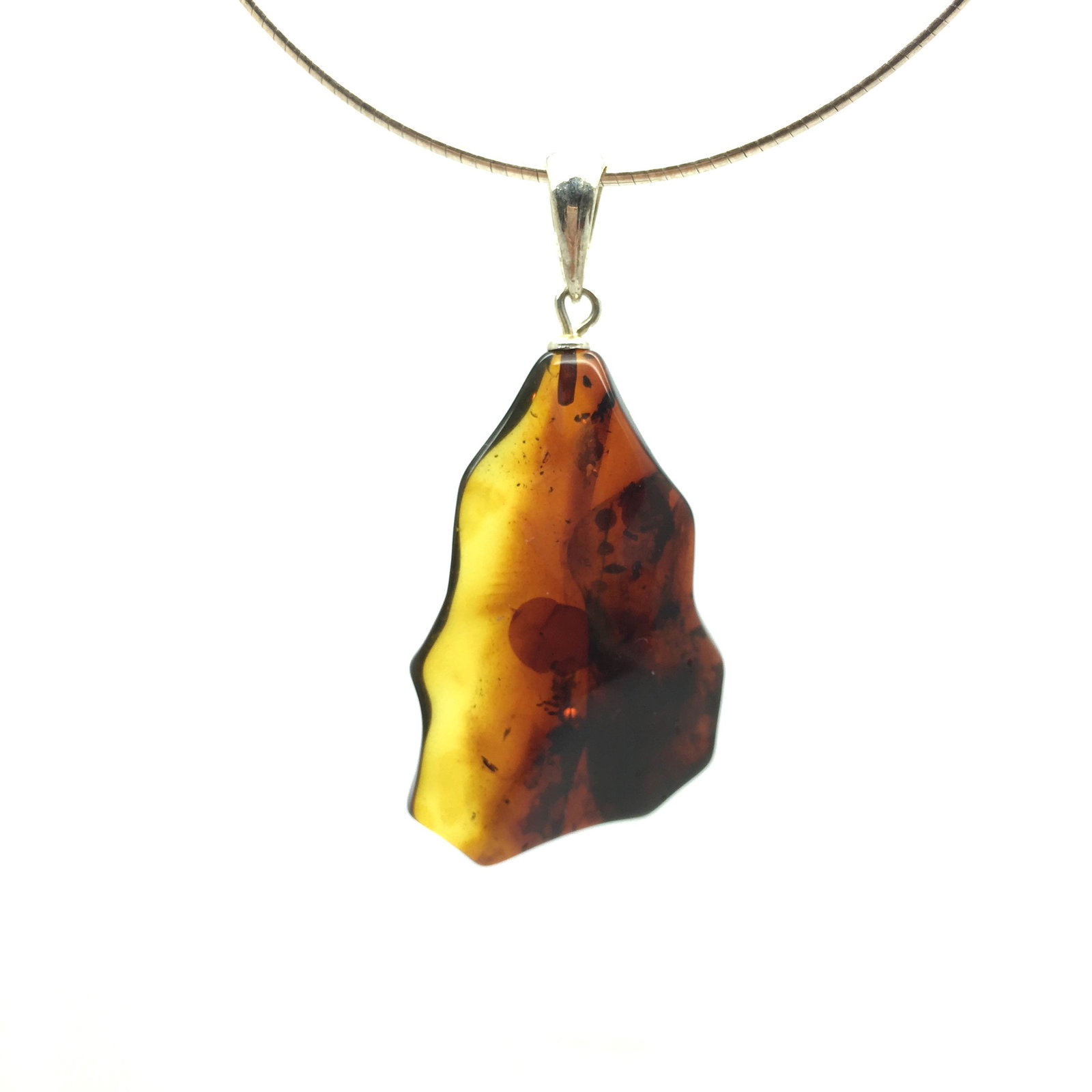 Baltic amber pendant cognac to lemon color hand: Title: Baltic amber pendant cognac to lemon color hand polished stone Metal: Gemstone: Baltic amber Weight: 7.2g Size: 5 x 24mm color: cognac to lemon Reserve: $50.00 Shipping: Worldwide: Flat-ra