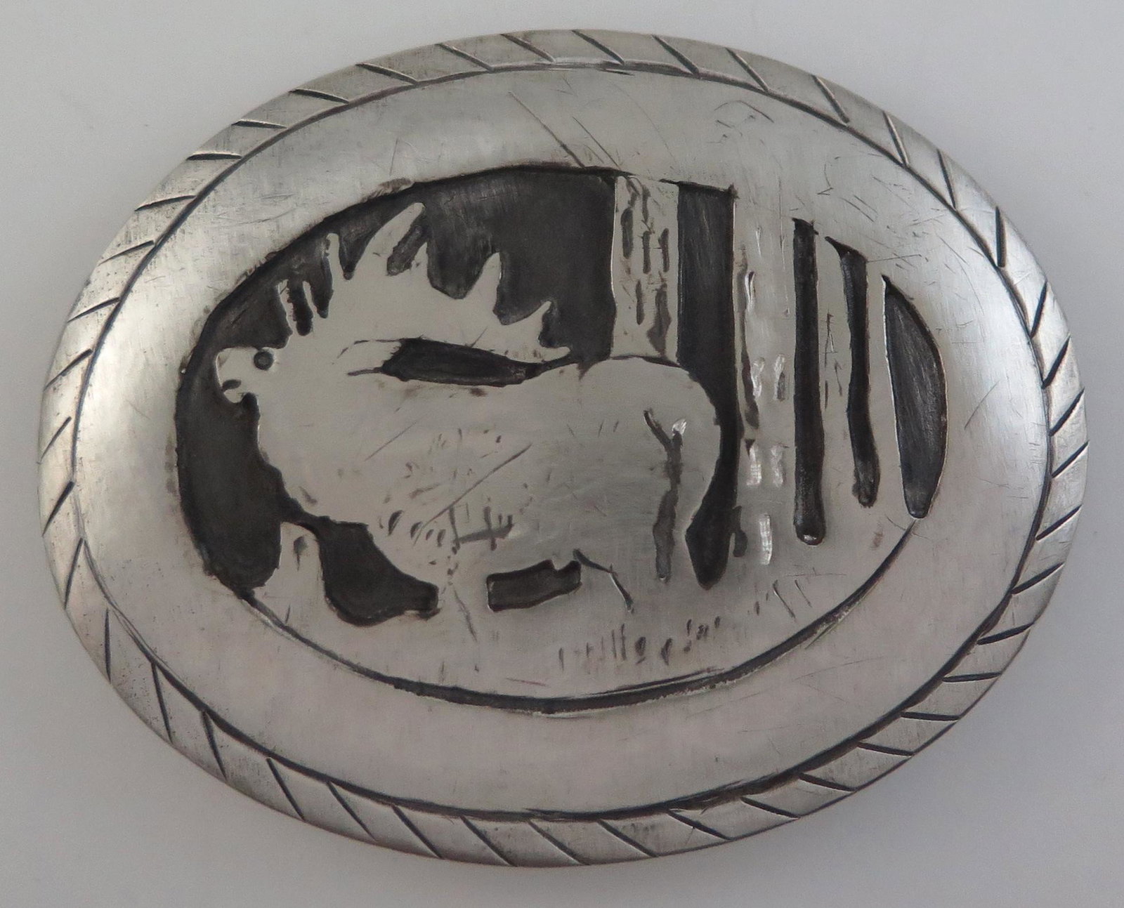 Unique Handmade Sterling Silver Moose Scene Western: Title: Unique Handmade Sterling Silver Moose Scene Western Belt Buckle Date/Period: 1970s Materials: Sterling Silver Dimensions: 3 & 1/16" long (7.78 cm) and 2 & 7/16" wide (6.19 cm) Unique Handmade S
