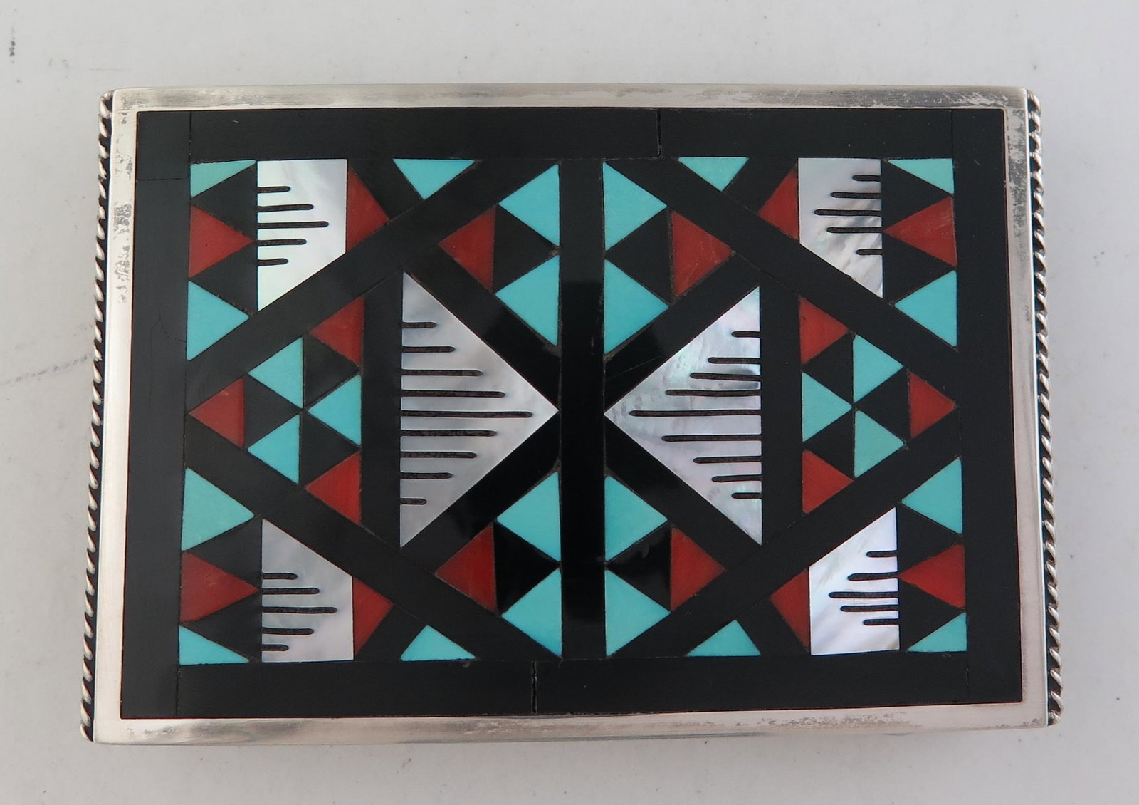 Zuni Leander & Lisa Othole Sterling Silver Flush Mosaic: Title: Zuni Leander & Lisa Othole Sterling Silver Flush Mosaic Inlay Belt Buckle Date/Period: 1990s Materials: Sterling Silver Dimensions: 3" long (7.6 cm) and 2" wide (5.1 cm) This beautiful sterling
