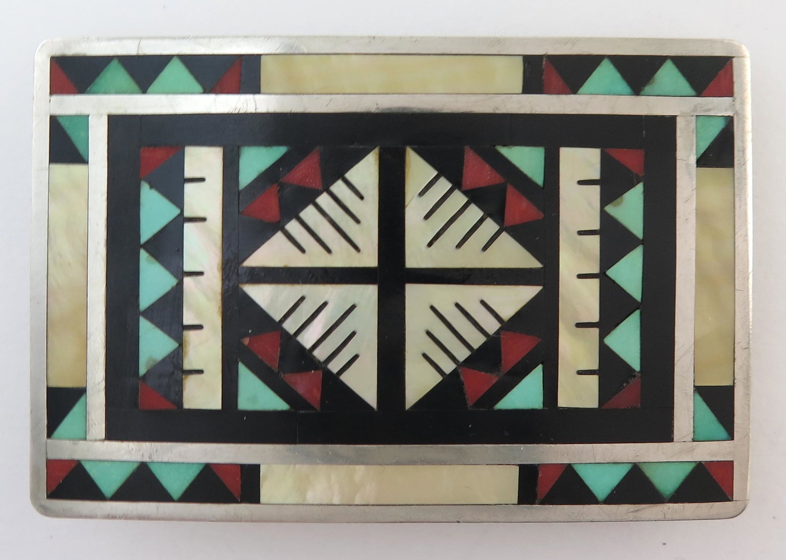 Zuni Alex & Marylita Boone Sterling Silver Flush Mosaic: Title: Zuni Alex & Marylita Boone Sterling Silver Flush Mosaic Inlay Belt Buckle Date/Period: 1990s Materials: Sterling Silver Dimensions: 3" long (7.6 cm) and 2" wide (5.1 cm) This beautiful sterling