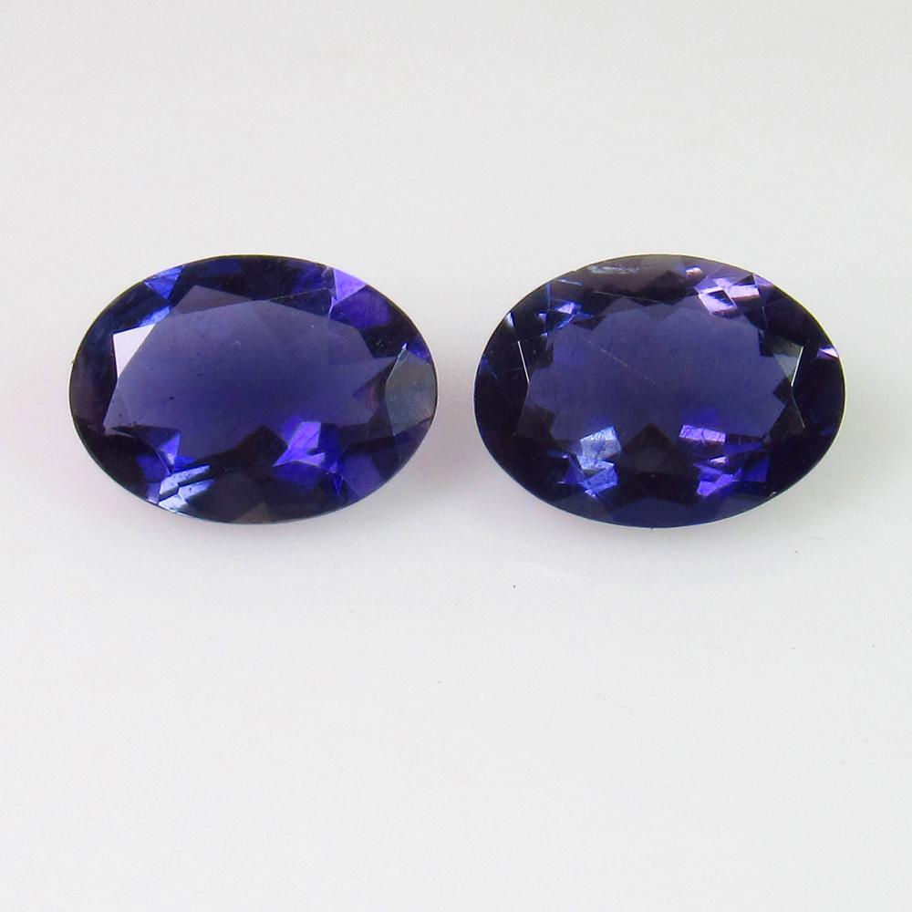 1.80 Ct Genuine Iolite 8X6 mm Oval Pair: No Reserve! Title: 1.80 Ct Genuine Iolite 8X6 mm Oval Pair Stone Clarity: VVS Loose Gemstone: Natural Iolite Carat Weights: 1.80 Size/Dimensions: 8.00 x 6.00 x 3.30 mm / 2 PC's Very Good Luster / Exce