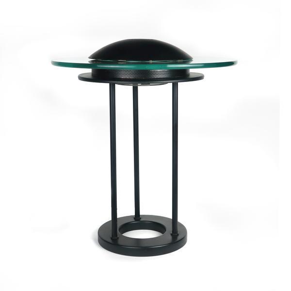 1980s “Saturn" flying saucer table lamp: An iconic 1980s “Saturn" flying saucer table lamp designed by Robert Sonneman for George Kovacs. All black with a pale green piece of round glass serving as Saturn’s ring, while also helping to sp
