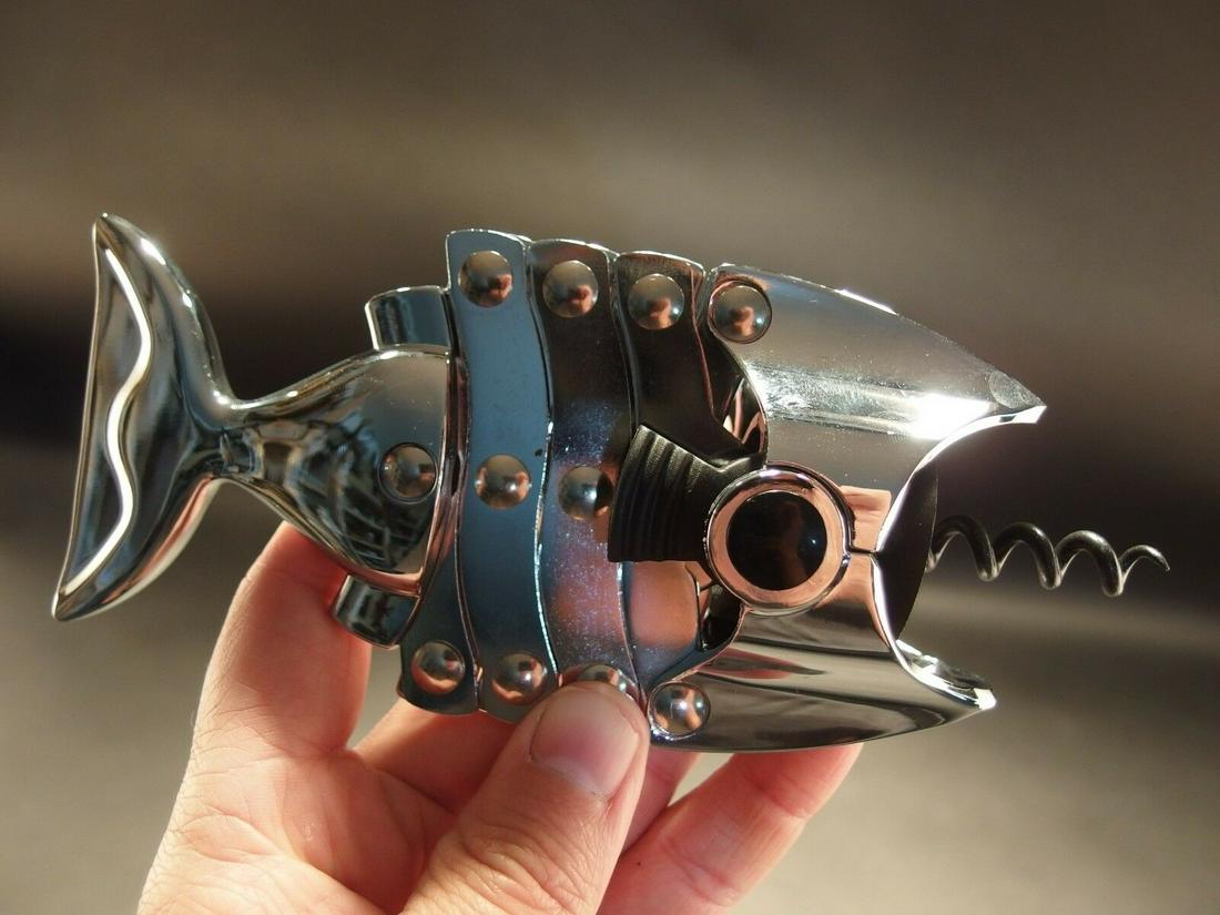 Fish Shaped Multilever Corkscrew: 6 3/4" Long Closed x 3" Wide Such a neat vintage style fish shaped multi lever cork screw. The riveted levers assist in pulling the cork out. Great for use or display! Reserve: $24.00 Shipping: Domest
